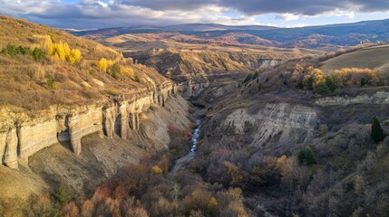 Awe-inspiring Mountain Valley in Autumn Colors: A Breathtaking Aerial View of a Canyon and Its Surrounding Terrain
