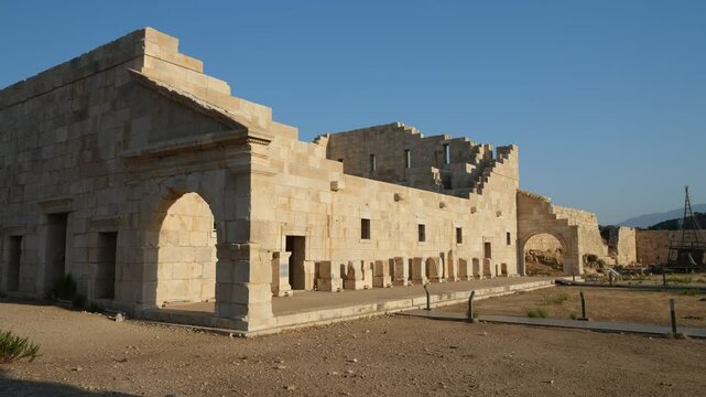 The ruins of the ancient city of Patara. Exterior view of the Roman Parliament building. Kas district, Antalya province, Turkey country - 4k video 
