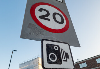 A road traffic sign for speed control of 20 miles per hour enforced road speed cameras.