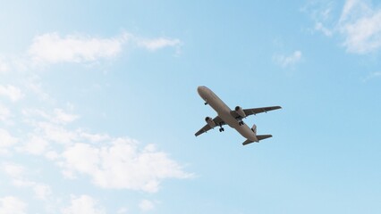 ULTRA HD. Airplane flies in blue sky. Travel, tourism. Airplane takes off against the background of blue sky.	
