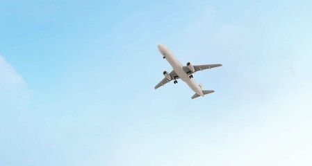 ULTRA HD. Airplane flies in blue sky. Travel, tourism. Airplane takes off against the background of blue sky.	
