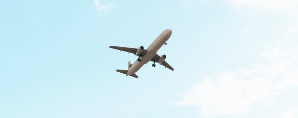 ULTRA HD. Airplane flies in blue sky. Travel, tourism. Airplane takes off against the background of blue sky.	
