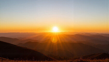 Obraz premium Radiant sunrise illuminating distant hills, serene morning landscape