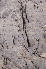 Layered rock in the Swiss Alps as background