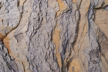 Layered rock with red veins in the Swiss Alps as background
