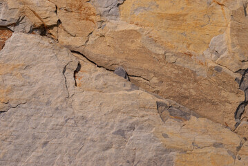 Layered rock with red veins in the Swiss Alps as background