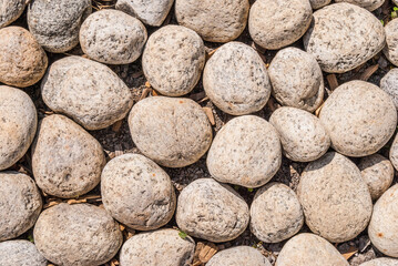 a grey brown large stone a cobblestone. Stone background