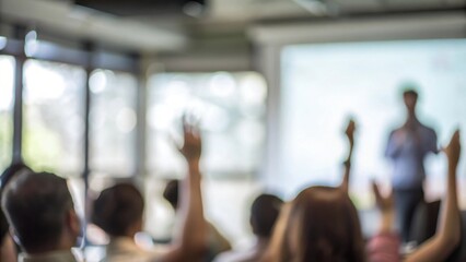 Interactive Q&A Session Blur: A seminar setting with a blurred speaker taking questions from an engaged audience.
