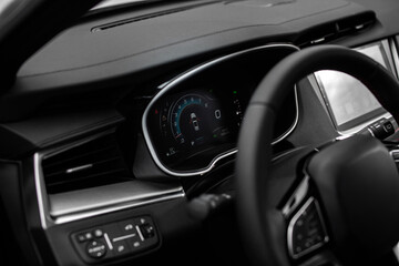 A car dashboard with a digital display showing the car's speed