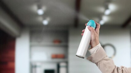 Close-up Of A Person's Hand Spraying Air Freshener
