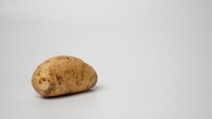 A fresh local raw honey cilembu sweet potato isolated on white background.