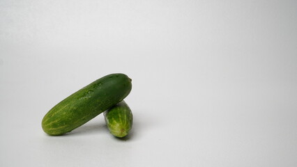 A bunch of fresh cucumbers isolated on a white background.
