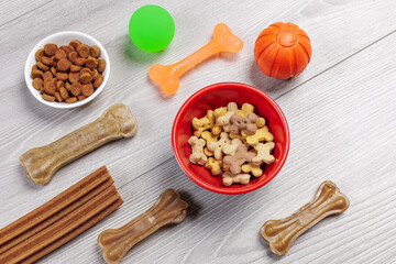 Pet supplies and playful items including dry food and toys for dogs.