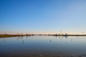 landscape with a lake on a cold winter day with sunshine