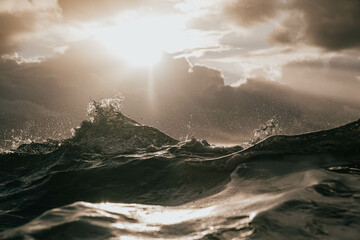 A large wave crashing into the shore