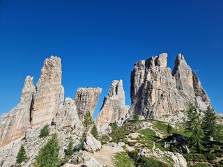Cinque Torri Dolomites against blue cloudy sky, in summer