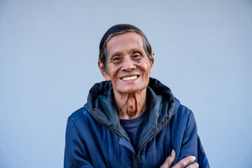 Portrait of attractive senior asian man smiling and looking at camera.  father concept..