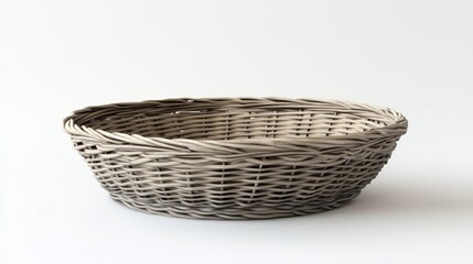 Obraz premium A simple wicker basket isolated against a white background