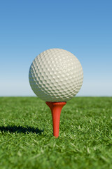 A golf ball on a tee against a clear blue sky, set in a lush green field. 3d rendering
