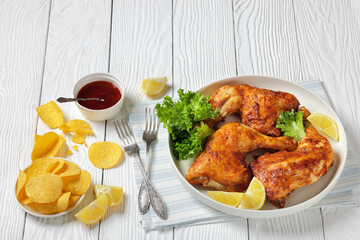 baked in oven three chicken leg quarters, top view