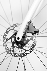 A close up of a bicycle's rear wheel with a chain and sprockets. Concept of motion and energy, as...
