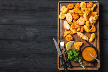 fried chunks, bites, tenders, nuggets on a plate