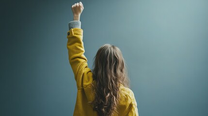 Woman in Yellow Jacket with Raised Arm