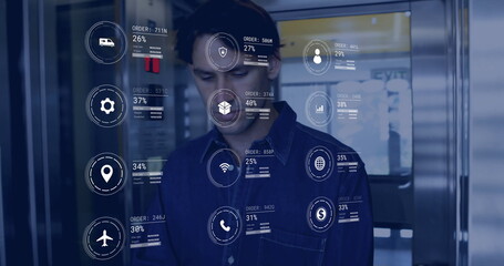 Image of icons and data processing over caucasian man working in warehouse