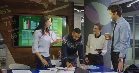 Image of financial data processing over diverse business people in office