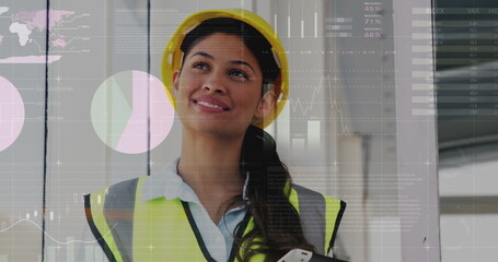 Image of financial data processing over biracial female architect using tablet in office