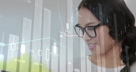 Image of financial data processing over asian businesswoman using tablet in office