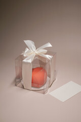 Heart shaped cake in a transparent box. Sweets delivery