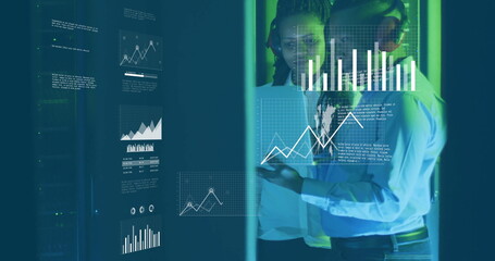 Image of diagrams and data processing over biracial workers in server room
