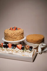 set of cakes decorated with ribbon and fruits