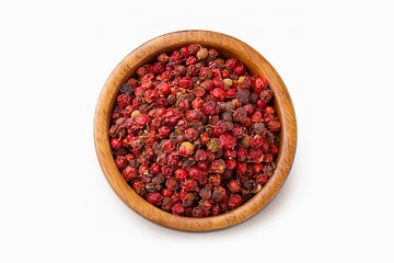 Sichuan pepper in a white bowl set against a white background. Sichuan pepper is a member of the sansho family used in Chinese cooking.