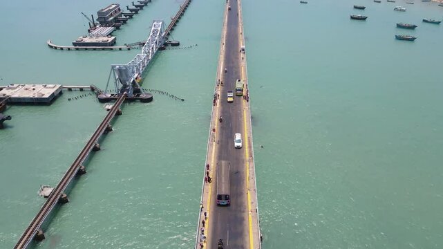 Majestic aerial drone shot of Rameshwaram city, with the bridge as a striking focal point over the sea.