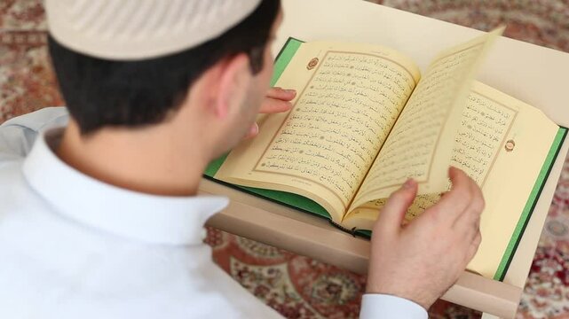Young muslim reading to ramadan moon