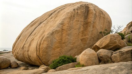 Close-up of a large granite boulder with a warm beige undertone, natural materials, geological features, rocky formations, rugged surfaces, outdoor landscapes