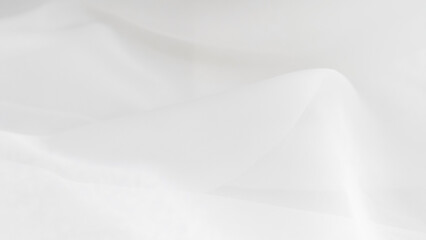 White tulle fabric background close-up, light sheer texture, elegant material.