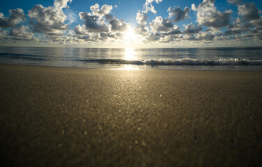 Obraz premium Sunset background. Sea with sky clouds reflection in water for background. Calm ocean wallpaper background. Sea background.