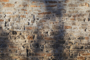 Rustic stone wall with weathered texture.
