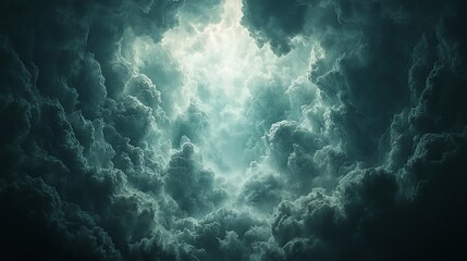 Obraz premium Dark clouds parting to reveal bright light.