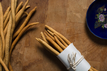 Top view of fried corn stick snack on a wood board, Overhead view of nigerian kokoro corn snack