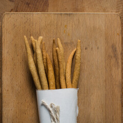 Top view of fried corn stick snack on a wood board, Overhead view of nigerian kokoro corn snack