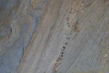 A mesmerizing natural pattern, sand layers form wavy, rhythmic designs. Shaped by wind or water,...