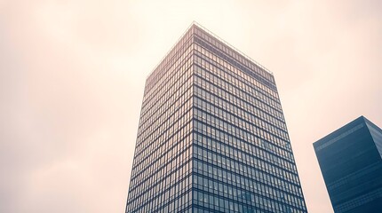 Obraz premium Exterior of a high-rise office building. Modern architecture with an abstract background, Modern building with curved glass facade reflecting sky