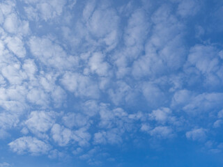 Fluffy white clouds, blue sky. Background, wallpaper.