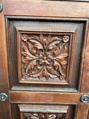 A wooden door with a design