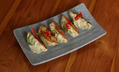 chinese food appetizer on wooden tableGenerated image