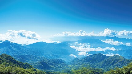 Obraz premium Mountain range panorama, clear sky, clouds, lush valley. Ideal for travel brochures